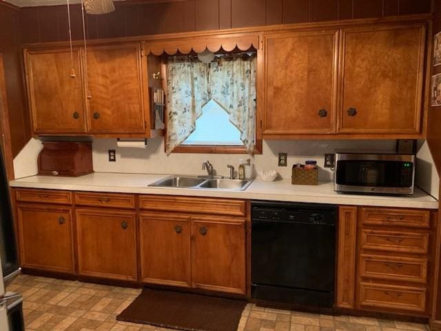 kitchen featuring sink and black dishwasher