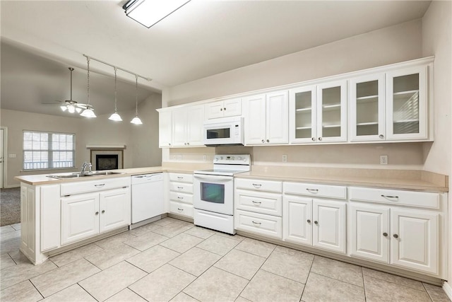 kitchen with white cabinetry, sink, hanging light fixtures, kitchen peninsula, and white appliances