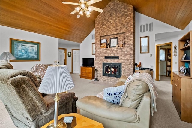 carpeted living room featuring a fireplace, high vaulted ceiling, ceiling fan, and wood ceiling