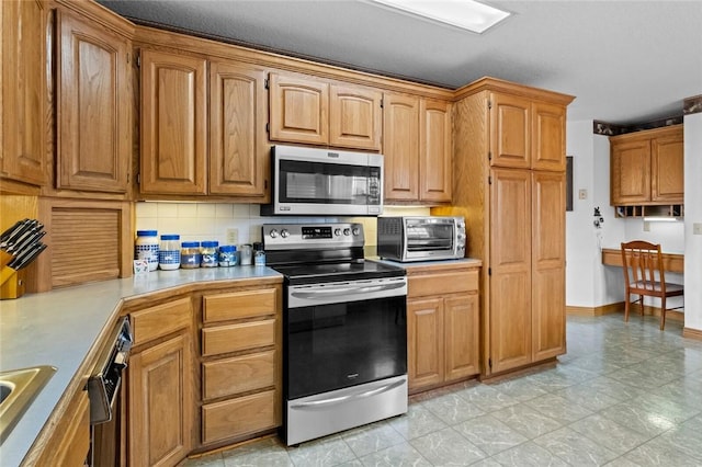 15262 Shipe Rd, Gravette, AR 72736 - kitchen with appliances with stainless steel finishes, light countertops, tasteful backsplash, brown cabinets, and a sink