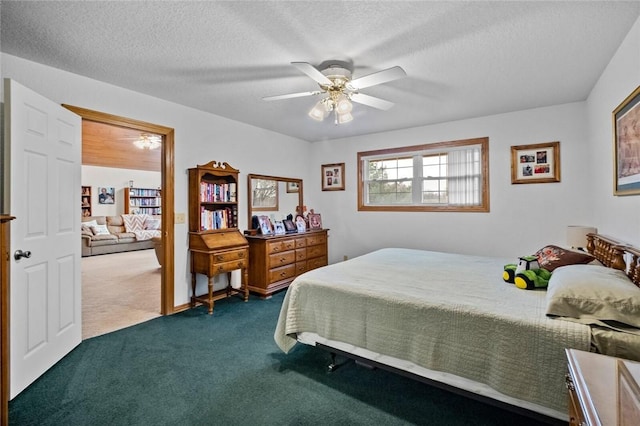 bedroom featuring ceiling fan, dark carpet, and a textured ceiling