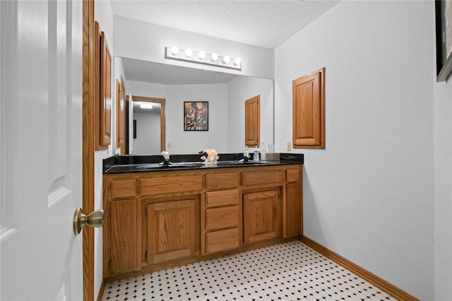 15262 Shipe Rd, Gravette, AR 72736 - full bath with double vanity, baseboards, and tile patterned floors