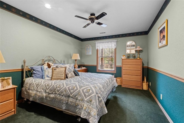 bedroom featuring dark carpet and ceiling fan