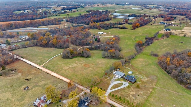 birds eye view of property featuring a rural view