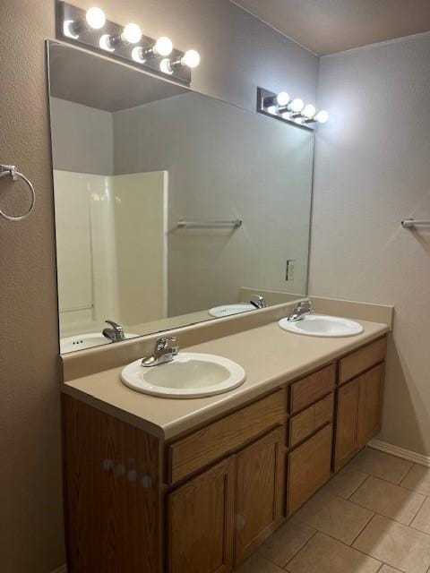 bathroom with tile patterned flooring and vanity