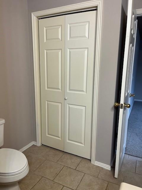 bathroom featuring tile patterned floors and toilet