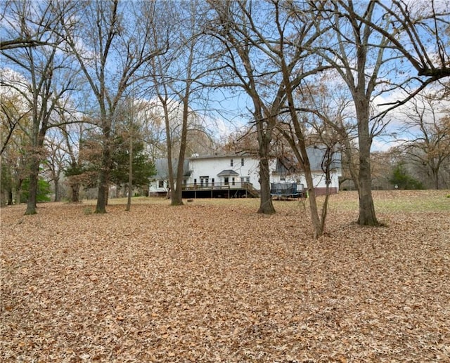 view of yard with a wooden deck