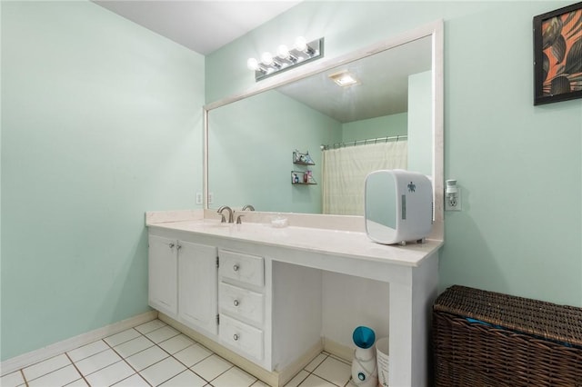 bathroom featuring tile patterned flooring and vanity