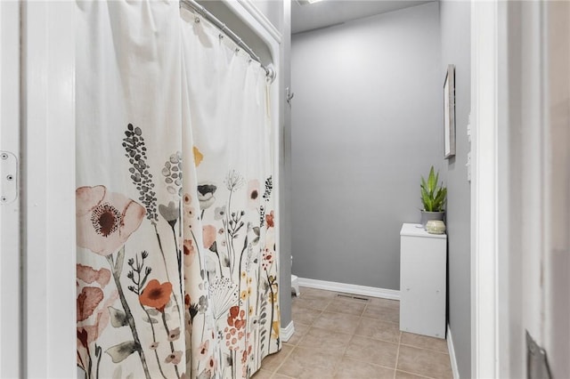 bathroom with tile patterned floors