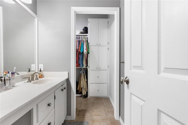 bathroom with tile patterned floors and vanity