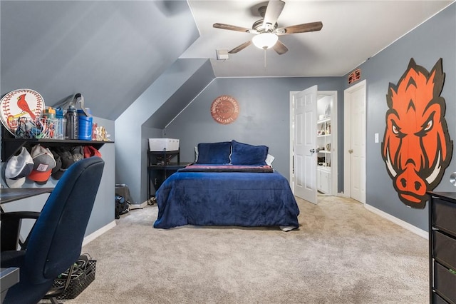 carpeted bedroom featuring ceiling fan and vaulted ceiling