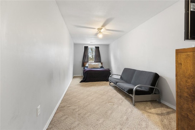 sitting room with light carpet and ceiling fan