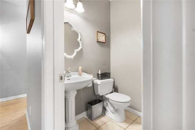 bathroom with tile patterned floors and toilet