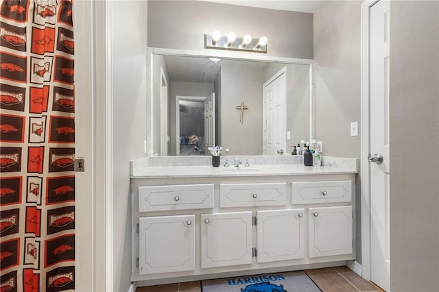 bathroom featuring tile patterned flooring and vanity