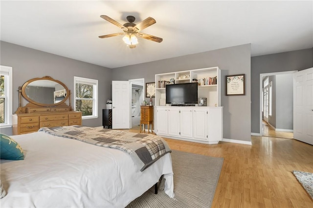 bedroom with ceiling fan and light hardwood / wood-style floors