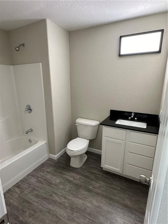 full bathroom featuring bathtub / shower combination, hardwood / wood-style floors, vanity, and toilet