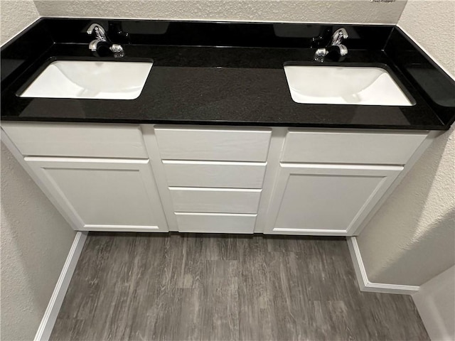 bathroom with hardwood / wood-style floors and vanity