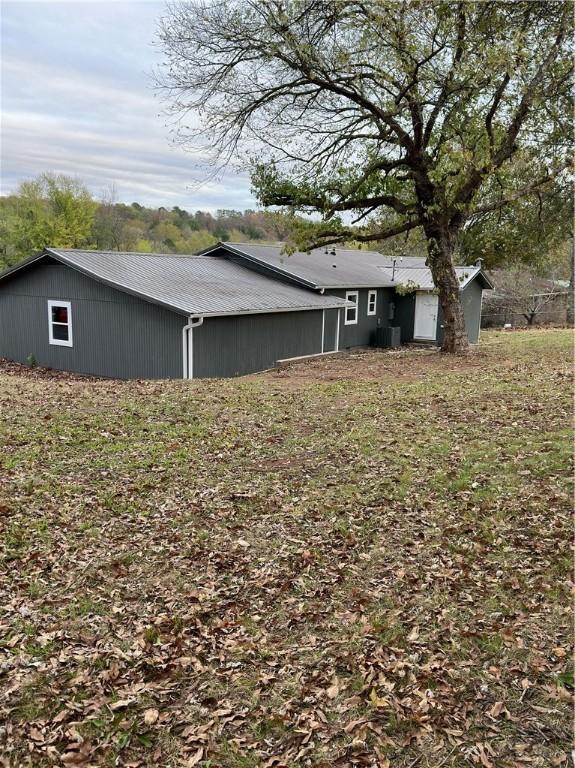 view of side of home with cooling unit