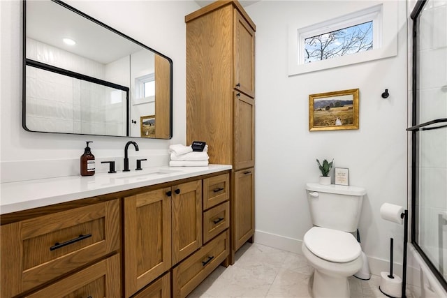 bathroom featuring baseboards, toilet, an enclosed shower, marble finish floor, and vanity