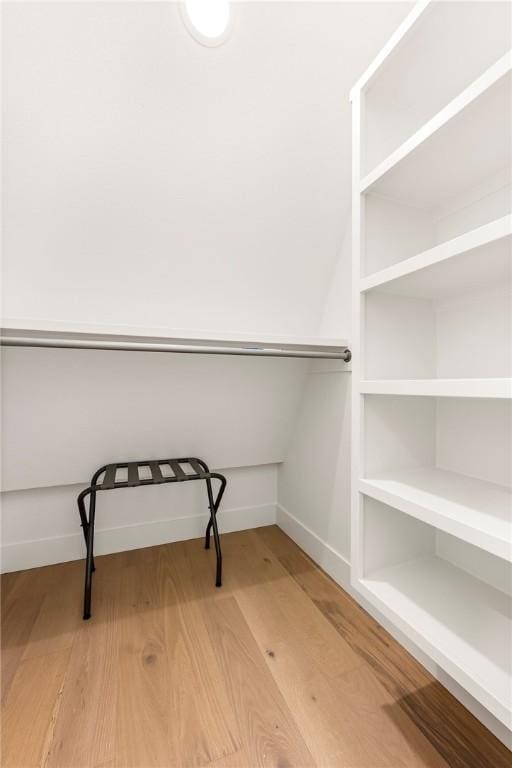 spacious closet with wood finished floors