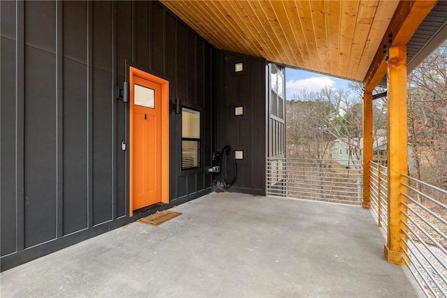 doorway to property featuring board and batten siding