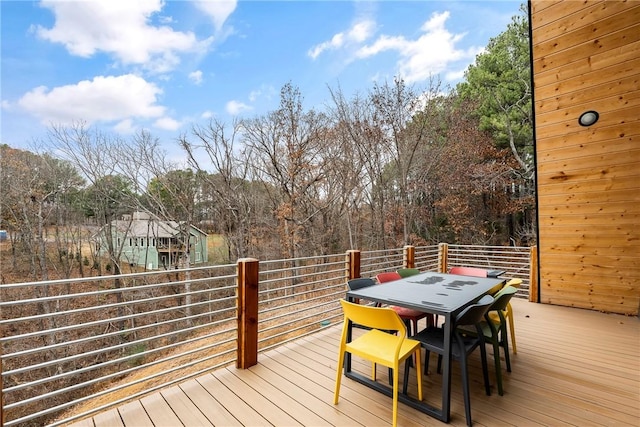 deck featuring outdoor dining area