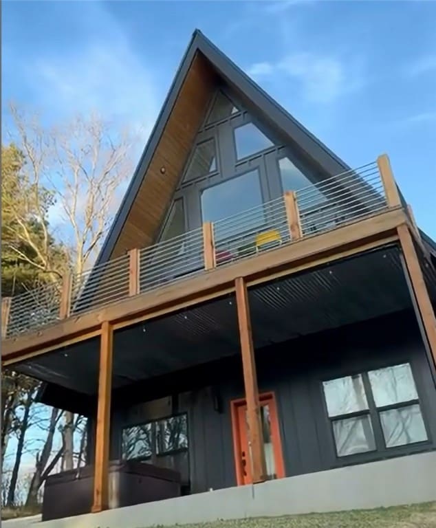 view of home's exterior with a balcony