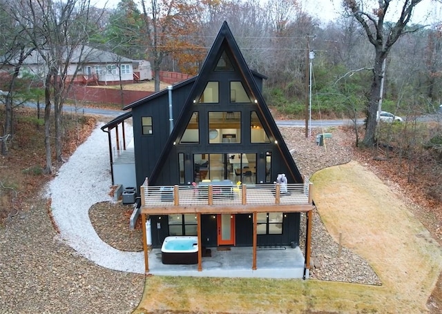 back of house with central AC unit and a patio area