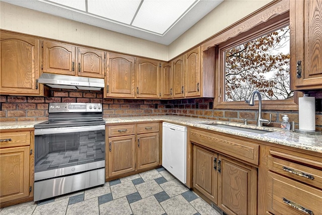 kitchen with dishwasher, electric stove, sink, and tasteful backsplash