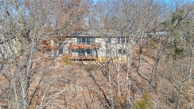 back of property featuring a deck