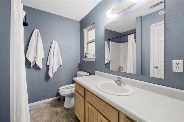 bathroom with vanity, a textured ceiling, hardwood / wood-style flooring, and toilet