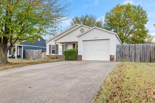 single story home featuring a garage and a front yard