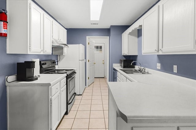 kitchen with light tile patterned flooring, sink, white cabinets, and stainless steel appliances