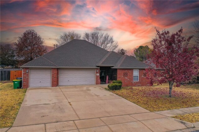 ranch-style home featuring a garage