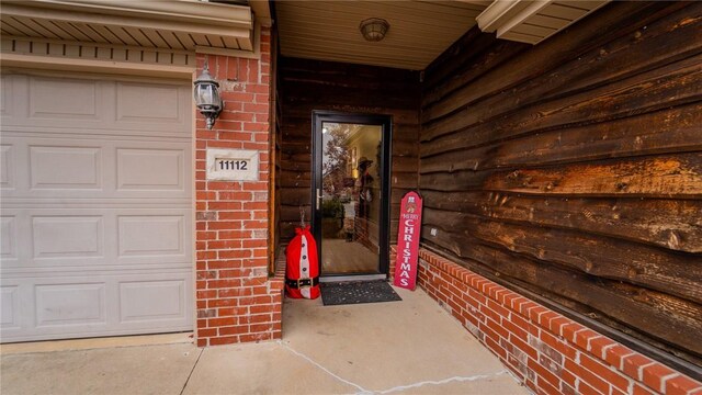 entrance to property featuring a garage