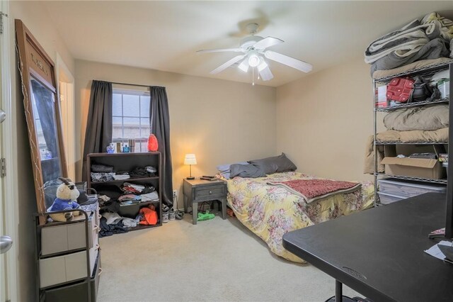 carpeted bedroom featuring ceiling fan