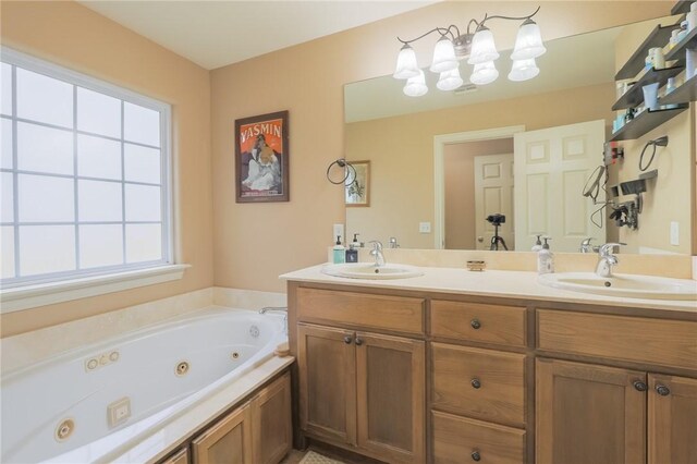 bathroom with vanity, plenty of natural light, and a bath