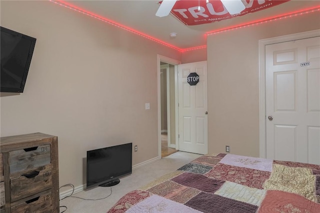 bedroom with ceiling fan and light colored carpet