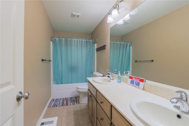 full bathroom featuring shower / bathtub combination with curtain, vanity, tile patterned floors, and toilet