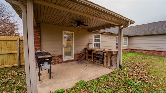 view of patio featuring ceiling fan and grilling area