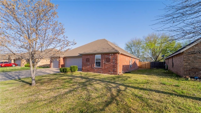 view of front of home with driveway, brick siding, and an attached garage