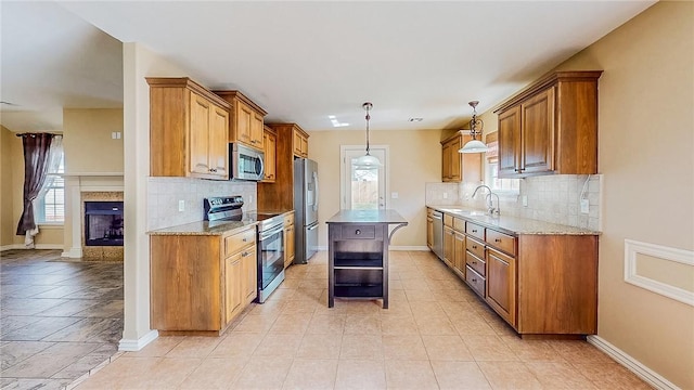 kitchen with appliances with stainless steel finishes, open shelves, healthy amount of natural light, and brown cabinets