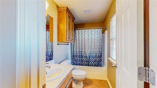 bathroom featuring vanity, tile patterned flooring, toilet, and shower / bath combo