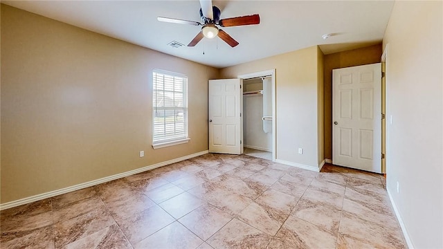 unfurnished bedroom featuring baseboards, a ceiling fan, and a closet