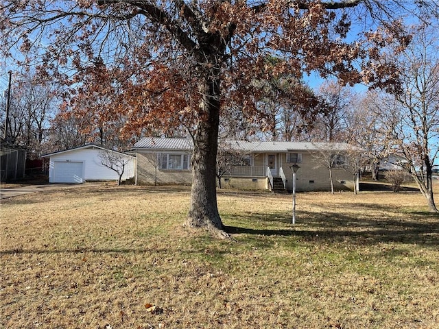 view of yard featuring an outbuilding and a garage