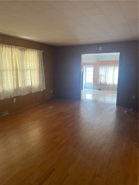 empty room with hardwood / wood-style floors