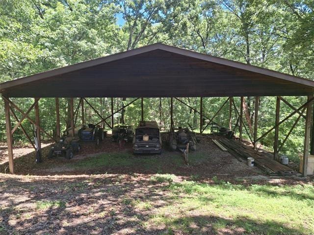 view of vehicle parking featuring a carport