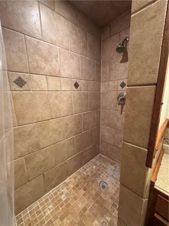 bathroom with a tile shower