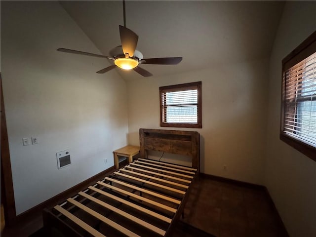 bedroom with ceiling fan and vaulted ceiling