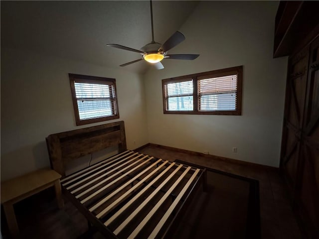 bedroom featuring vaulted ceiling and ceiling fan